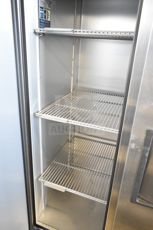 2024 True T-35-HC Commercial 2 Door Reach In Cooler, stainless steel interior, visible shelving, 115 volts, 1 phase.