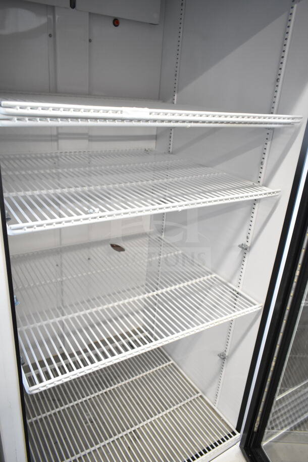 2021 True TSCI-600R-G-PH commercial cooler, single glass door, adjustable shelves, 115V, excellent condition.