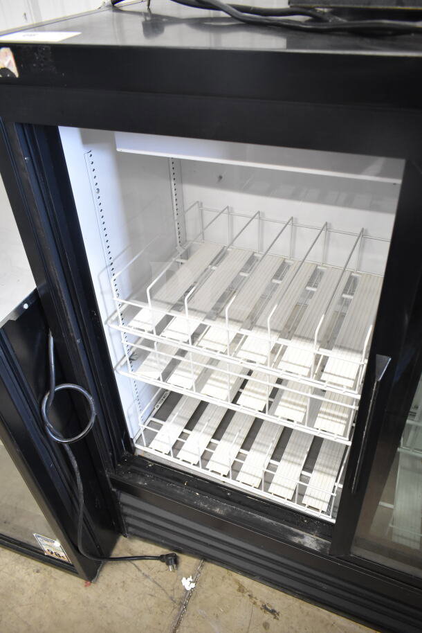 2019 True GDM-41SL-48-HC-LD commercial cooler, 2 glass doors, shelves inside, black frame, 115V, excellent condition.