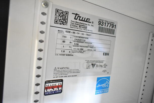 2018 True GDM-06-34-HC cooler label showing model, serial number, voltage (115V), phase (1), and "Made in USA" marking.