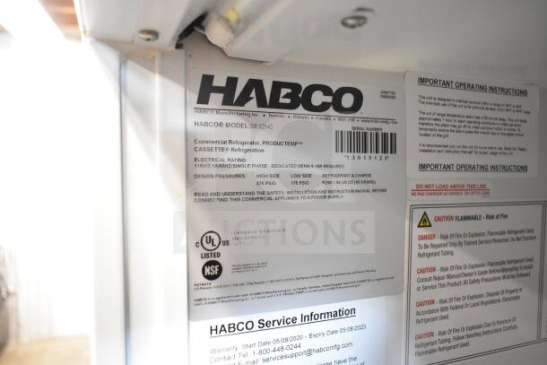 Habco SE12HC Commercial Cooler, 115V, Single Door, tags show model details, UL and NSF listed, safety instructions visible.