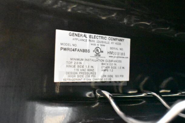 Label on General Electric GE PWR04FANBBS beverage cooler displays model and serial numbers, voltage, and installation details.