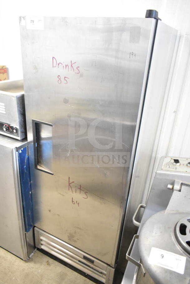 2020 True T-12-HC commercial cooler, single door, stainless steel, 115V, visible wear, markings on door, ideal for beverages.