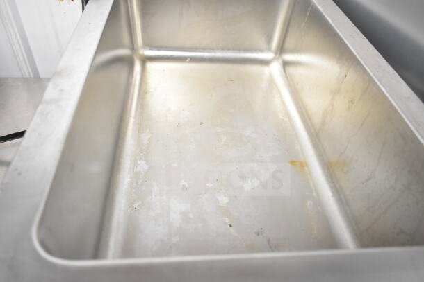 Winco FW-S600 countertop food warmer, stainless steel, 120 volts, single phase, used condition with visible wear.