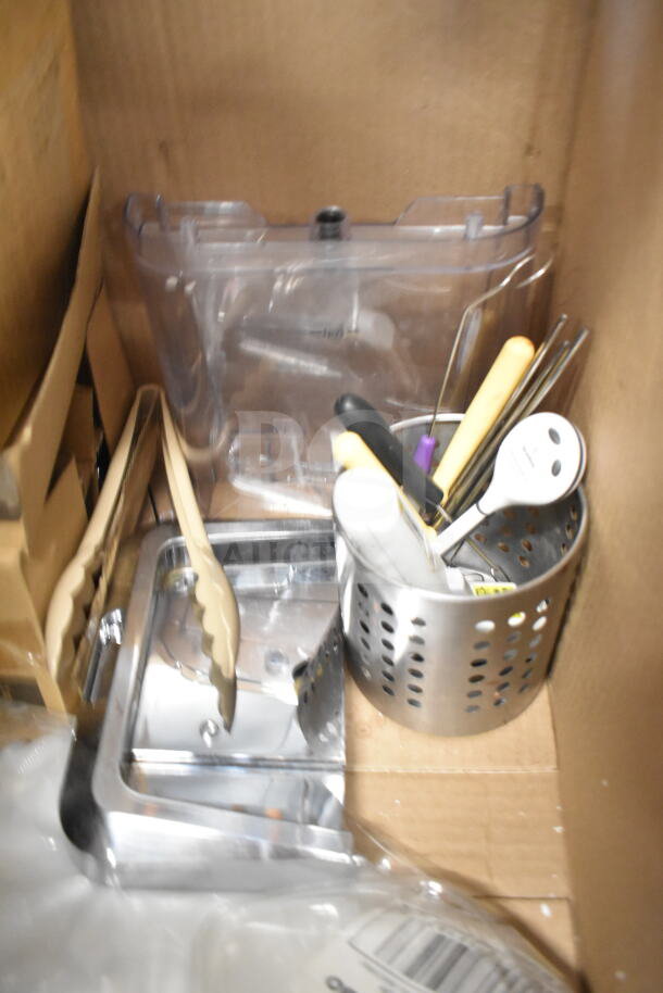Assorted kitchen utensils and frying pans in a box, includes tongs, metal utensil holder, and slicer. Mixed condition.