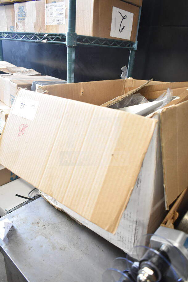 Open cardboard box with various frying pans and utensils, mix of conditions. Label indicates “Lot 77.”