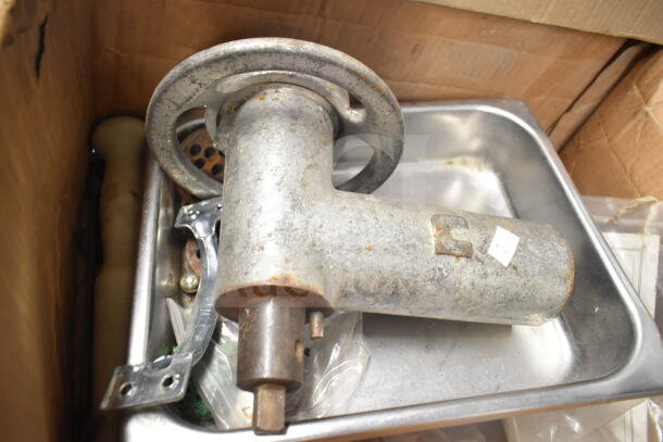 Meat grinder attachment with tray, metal body, shows signs of rust and wear. Suitable for kitchen equipment collectors.