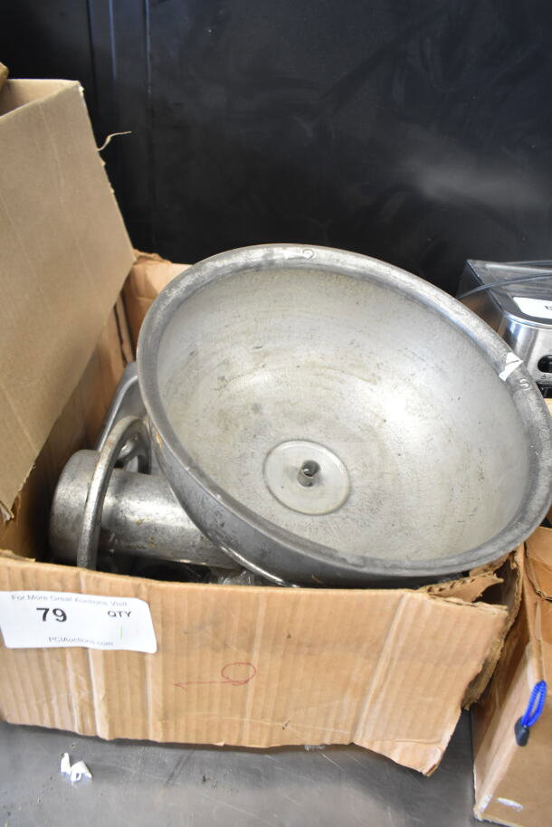 Metal meat grinder attachment with tray in a cardboard box, showing signs of wear. Auction lot number 79 visible on box label.