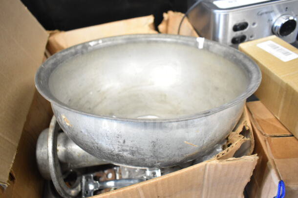 Meat grinder attachment with tray, metallic finish, used condition, visible wear, boxed packaging.