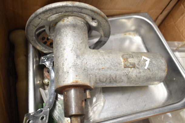 Meat grinder attachment with tray, metal construction, visible wear, rust spots, model marking "7."