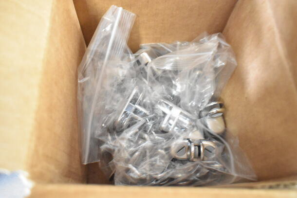 Box of various metal pieces in plastic bags. Items appear new, organized for auction sale.