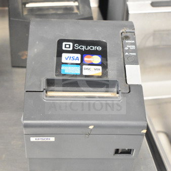Epson M129H receipt printer with Square compatibility, showing wear. Labels for Visa, MasterCard, and other cards.