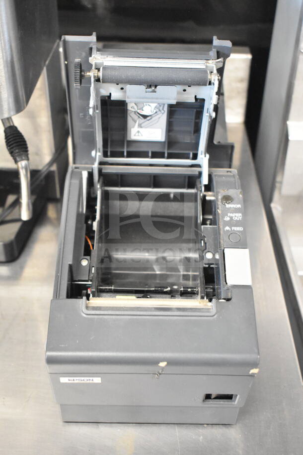 Epson M129H receipt printer with open cover, showing internal components. Label visible. Used condition.