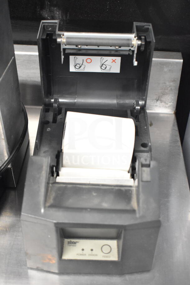 Epson M129H receipt printer, open with paper roll, model Star TSP600, includes power, error, and feed indicators.
