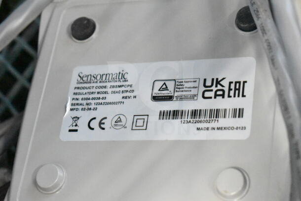 Sensormatic ZBSMPCPE with label showing product code, serial number 123A2206002771, and manufacturing details.
