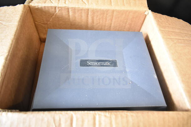 Box containing Sensormatic items, featuring ZBAMB9010-IPS Label Deactivator, pristine condition.