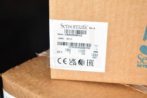 Sensormatic ZBAMB9012 label on a cardboard box, part of a 6-item auction lot including deactivators and antennas.