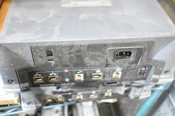 5 Sensormatic AMB-9010-IPS label deactivators. Used condition with visible ports and connections. Logo on top.