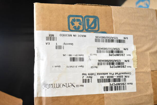 Sensormatic ZBSMPCPEF Compact Pad Pro FM ANT box with labels, new condition, made in Mexico, serial numbers visible.