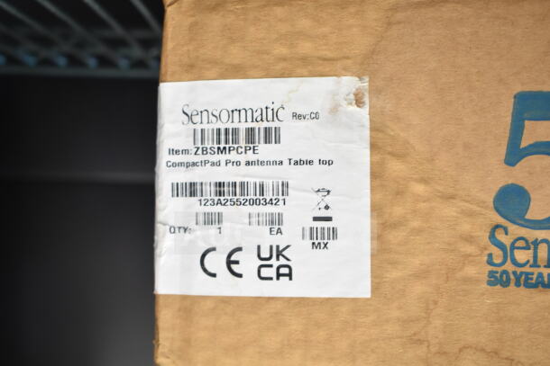 3 Sensormatic ZBAMB9012 Deactivators with ZBSMPCPE Compact Pad Pro Antenna Tabletop in original packaging. Labels detail item specs.