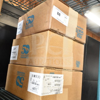 Three Sensormatic boxes on metal shelf, labeled ZBAMB9012 AMB-9012 Label Deactivator and ZBSMPCPEF CompactPad Pro Antenna.
