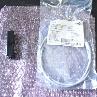4 Sensormatic 0352-0659-01 Ethernet Isolators on bubble wrap; new condition with packaging.
