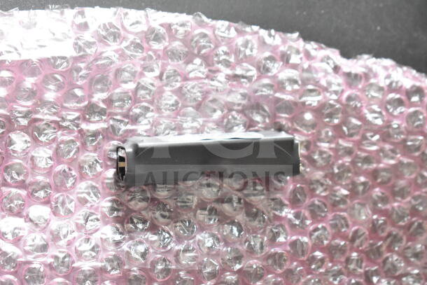 4 Sensormatic 0352-0659-01 Ethernet Isolators, new, on bubble wrap. Reliable device for secure network connections.