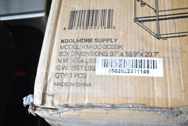 Box containing a KoolMore KM-DC-3CSBK pastry display case, 33 in., 2-tiered, 3.2 cu. ft. capacity, brand new with scratches.