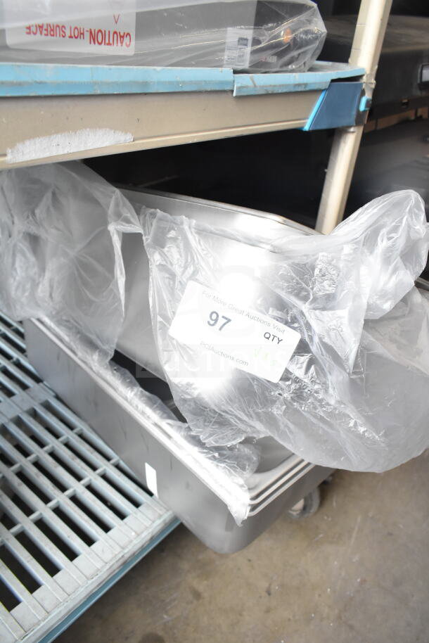Stainless steel steam table pans, 5 pieces, Vigor brand, anti-jam, new condition, labeled with item number 97.