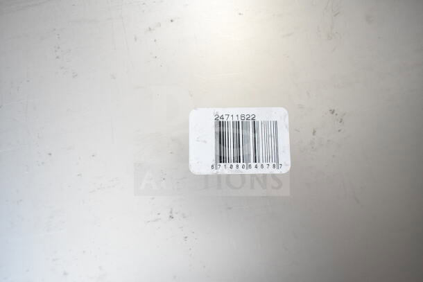 Barcode label reading "24711622" on stainless steel surface, indicating Vigor full-size steam table pan, 22 gauge.