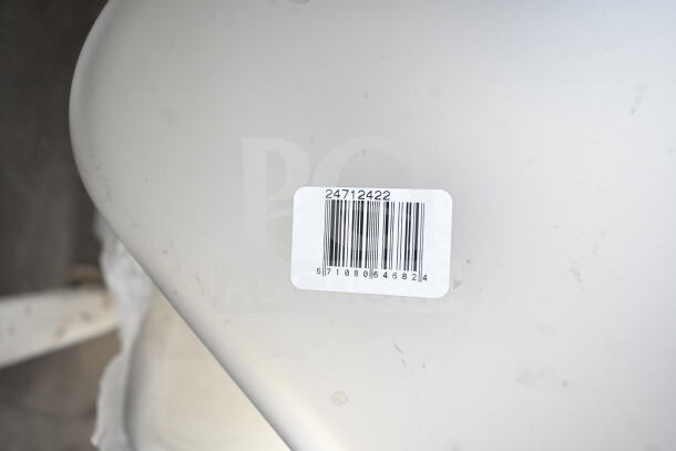 Barcode label on stainless steel surface, indicating Vigor 1/2 Size 4" Deep Anti-Jam Steam Table Pan, 22 Gauge.