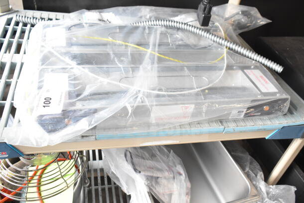 Brand new ServIt 423SW24THDBLA 24" double strip warmer, scratch and dent, dual toggle controls, 120V, 1 phase.