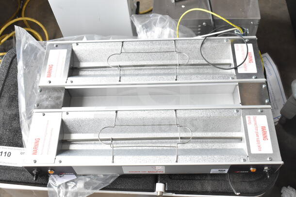 Brand new ServIt 423SW24THDBLA 24" double strip warmer, dual toggle controls, 120V, 1 phase, with scratch and dent marks.