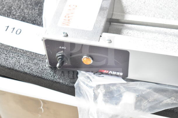 BRAND NEW SCRATCH AND DENT! ServIt 423SW24THDBLA 24" Double Strip Warmer, dual toggle controls, 120V, 1 phase, visible label.