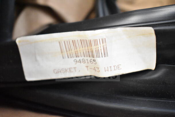Brand new True 948165 door gasket, T-43 Wide, with visible barcode label. Minor scratches noted. Ideal for refrigerator repair.
