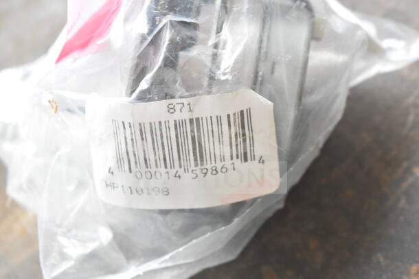 Plastic-wrapped timer with barcode and label showing "HP110198" part of a lot including Robot Coupe blade and oven knob.