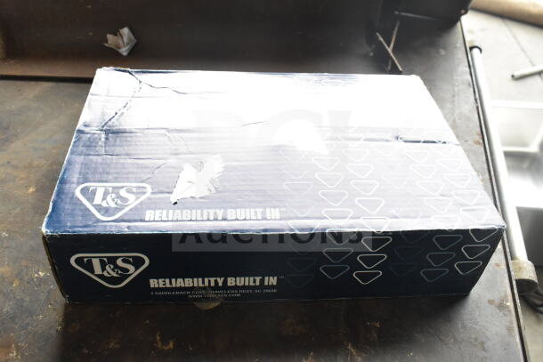 Box of T&S B-0591 24" pot filler faucet, scratch and dent. Features "Reliability Built In" branding. Box shows wear.