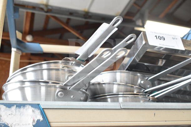 8 new Choice 8" aluminum non-stick fry pans, scratch and dent condition, with ergonomic handles visible.