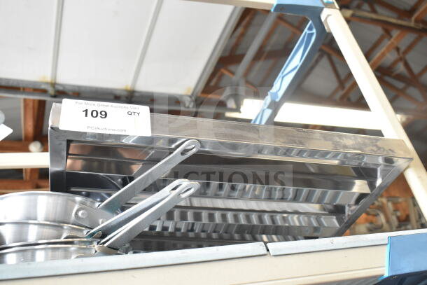 Brand new 16"x16"x2" stainless steel hood filter, scratch and dent, item tag "109", PCI Auctions label visible.