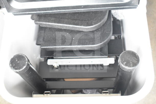 Brand new cooler with minor scratches and dents. Interior view showing stacked shelves and support rods.