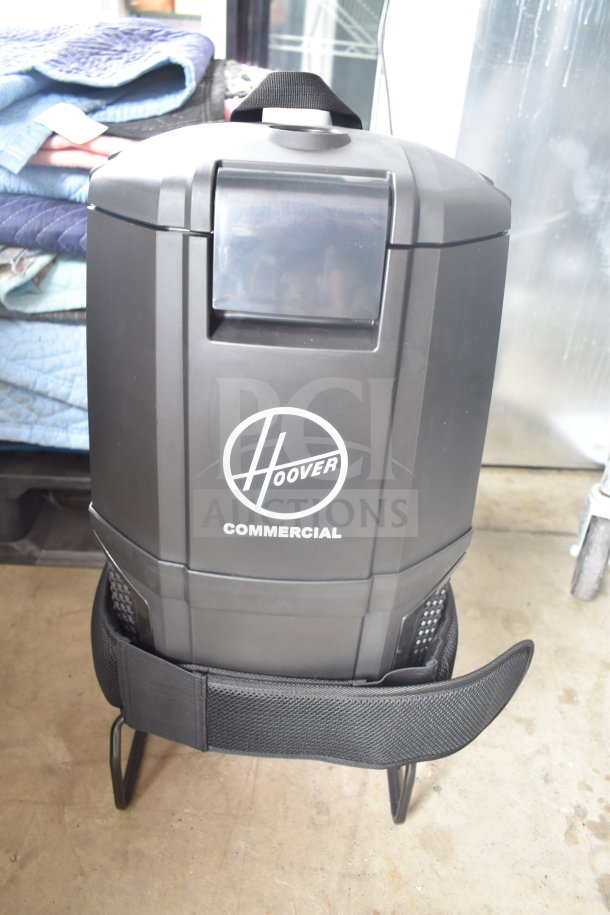 Brand new Hoover CH93600 cordless backpack vacuum, 40V with 8.0 Ah battery, charger, 10 bags. Scratch and dent condition.