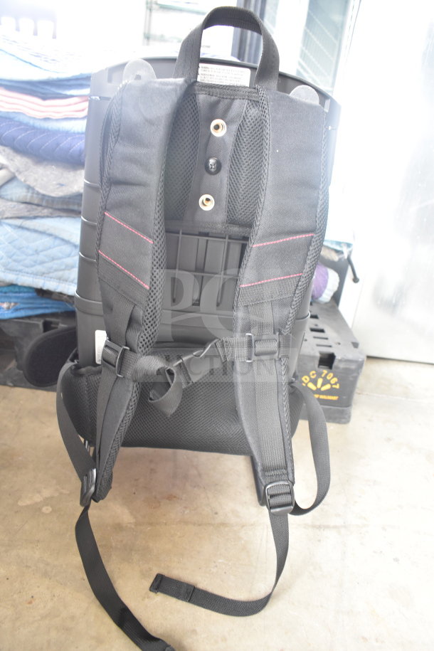 Brand new Hoover CH93600 cordless backpack vacuum, 40V with 10 bags, 8.0 Ah battery, and charger, minor scratches.