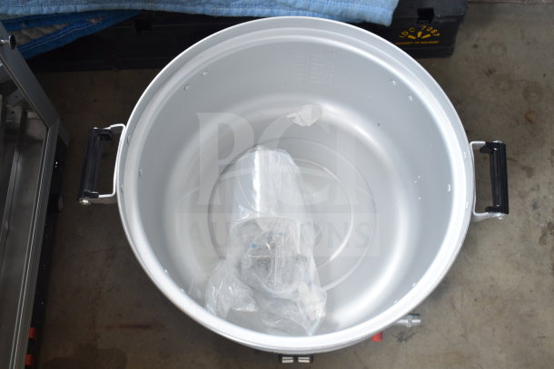 Brand new Avantco 177GRC110LP gas rice cooker, 110 cup capacity, with visible handles and inner markings, wrapped components inside.