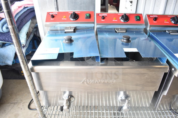 Brand new Avantco 177F202, 30 lb. dual tank electric countertop fryer, 208-240V, with protective blue covering.