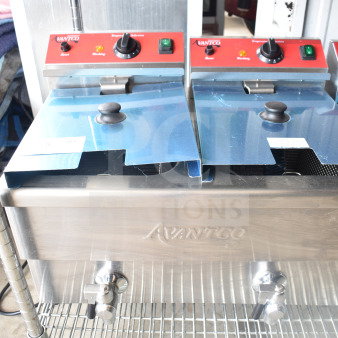 Brand new Avantco 177F202, 30 lb. dual tank electric countertop fryer, 208-240V, with protective blue covering.