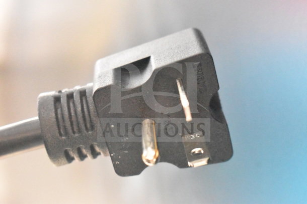 Close-up of a power plug for the Avantco 177F202 dual tank electric fryer, 208-240V, showing prongs and markings.