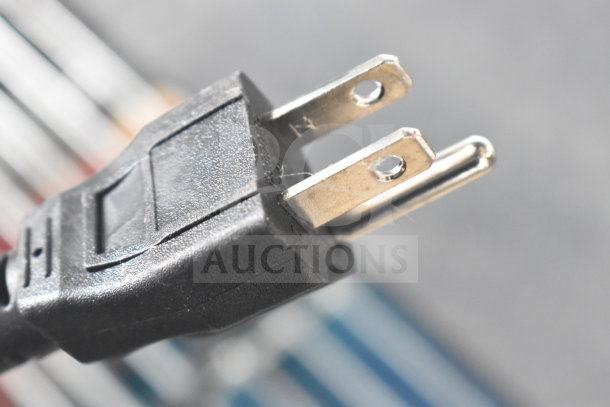 Close-up of a U.S. power plug, part of the AvaWeigh 334PCSP30 digital scale with thermal label printer.