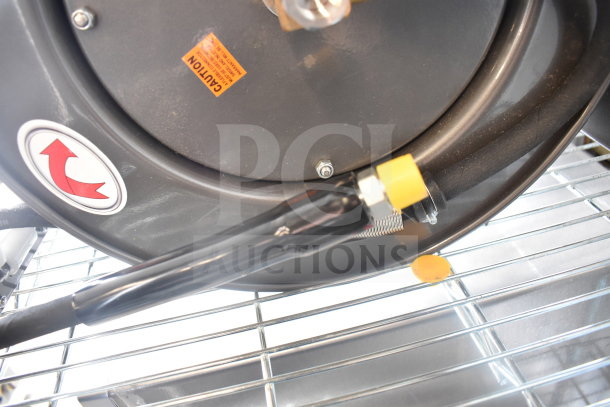 BRAND NEW Equip 5HR-232-01 hose reel, 35' hose, 2.27 GPM spray valve; visible caution labels. Scratch and dent condition.