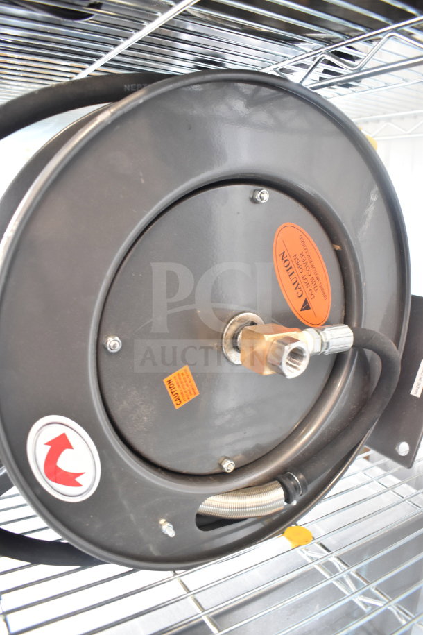 BRAND NEW Equip 5HR-232-01 hose reel with 35' hose, 2.27 GPM spray valve. Scratch and dent condition, visible caution labels.