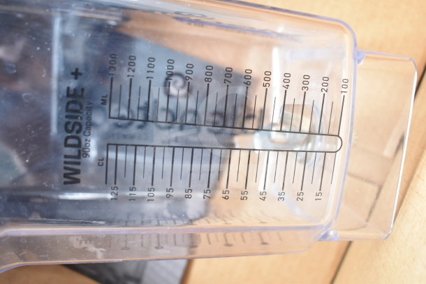BRAND NEW Blendtec C825C11Q-B1GB1D blender showing a 90 oz. WildSide+ jar. Marked with milliliter and ounce measurements.